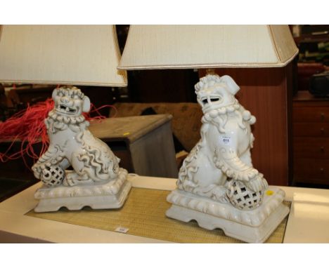 A LARGE PAIR OF CERAMIC TEMPLE DOG TABLE LAMPS & SHADES