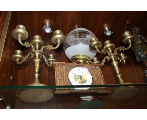 A CONVERTED OIL LAMP, A PAIR OF BRASS FOUR BRANCH CANDLESTICKS AND A SMALL OAK MANTEL CLOCK