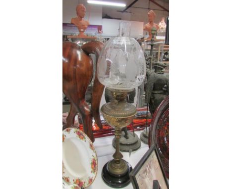 A Victorian brass column oil lamp with original etched shade