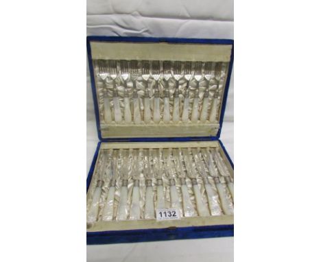 A cased set of 12 silver and mother of pearl knives and forks (24 pieces in total) HM Sheffield 1885/86