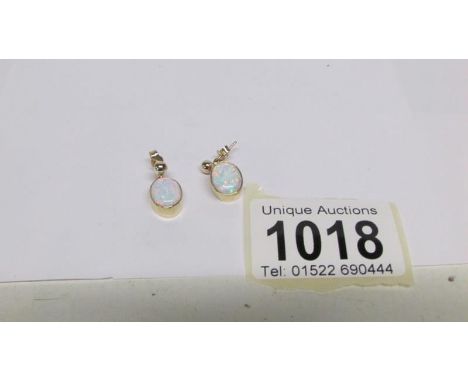 A pair of 9ct gold opal earrings