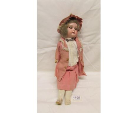 A 19th century bisque head doll marked Germany C O