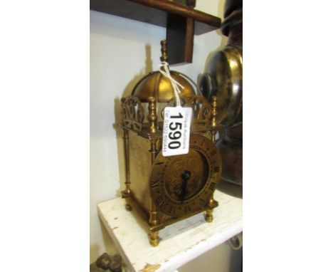 A brass Smith's lantern clock with wind up movement