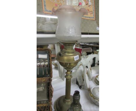 A Victorian brass column Young's oil lamp with later shade
