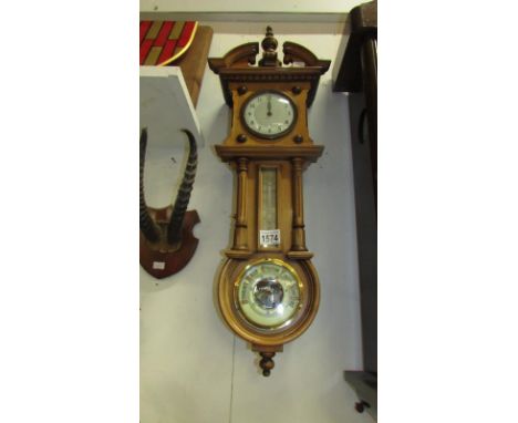 A light oak wall clock