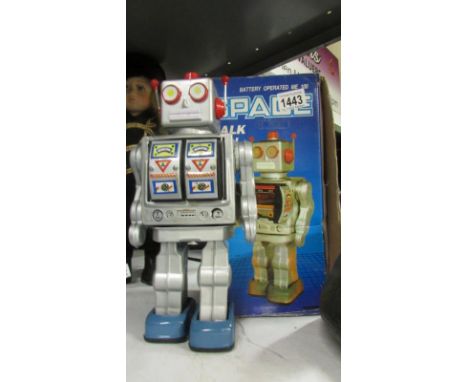 A boxed 1970's tinplate battery space walk man robot