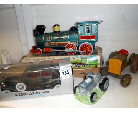 Boxed tinplate train, Mettoy tractor, Lincoln model car radio porcelain tractor egg cups