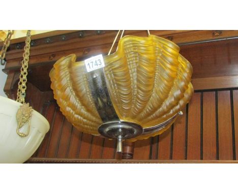 A Art Deco amber glass clam shell ceiling light