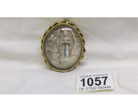 An 'Our Lady of Knock' 19th century brass finial plaque