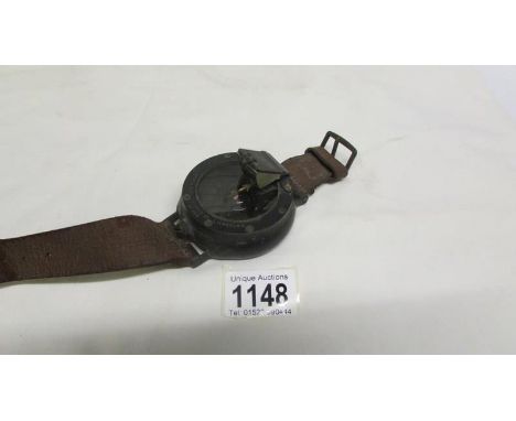 A WW1 Royal Flying Corps RFC/RNAS pilot/observer compass with blackened brass body by Dent & Co., complete with strap