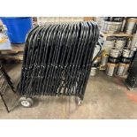 WHEELED CHAIR DOLLY CART W/ 41 FOLDING CHAIRS. THE CHAIRS HAVE METAL FRAMES AND COMPOSITE PLASTIC