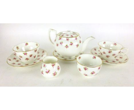A Hammersley ceramic 'tea-for-two' service, with hand painted pink rose design on a white ground within a gilt edge  CONDITIO