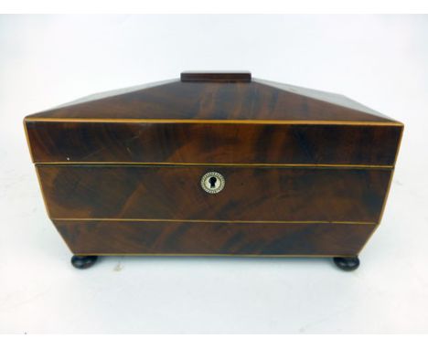 A Regency mahogany and box wood line inlaid sarcophagus form tea caddy on rose wood squat bun feet. h. 18.5 cm, w. 36 cm, d. 