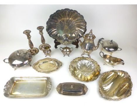 A large quantity of silver plated items to include punch ladle, a plate, coffee pot, creamer, pair of candlesticks, shell bon