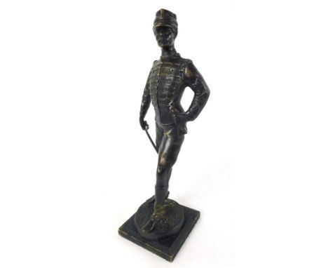 A 19th century bronze figure of a cavalry officer, holding a crop and gloves, on a square wooden plinth, h. 38 cm 