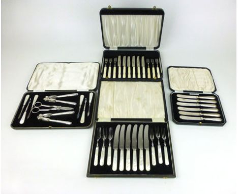 A cased set of six James Walker fruit knives having silver handles, together with a boxed set of six fruit knives and forks w