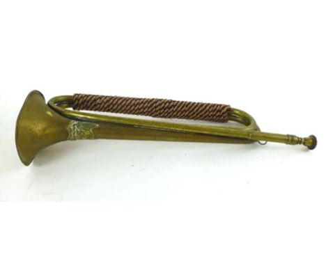 An early 20th century brass bugle marked with the Ayrshire Yeomanry crest, with red white and blue binding l. 45cm 