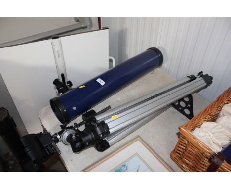 A telescope on tripod stand