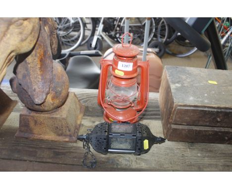 A metal lamp and a candle lantern 
