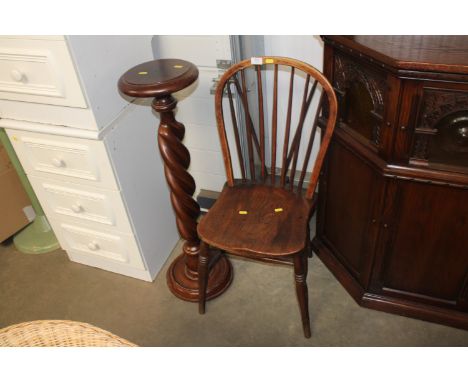 An elm seated stick back dining chair and a mahogany torchiere stand