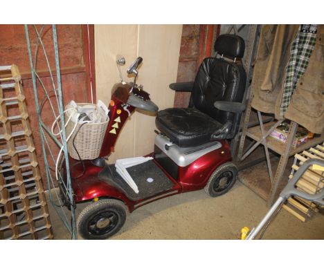 A Shoprider mobility buggy with charger and key, with V5