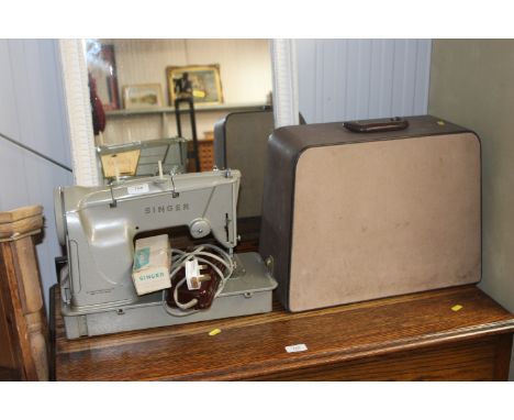 An electric Singer sewing machine in case
