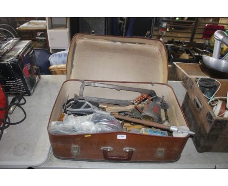 A suitcase and contents of various hand tools, shooting stick, blow lamp etc 