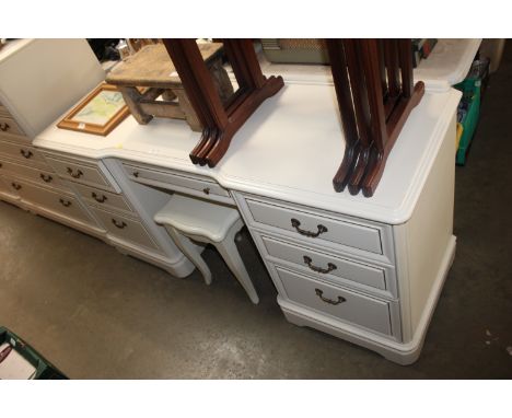A modern dressing chest fitted seven drawers and a stool