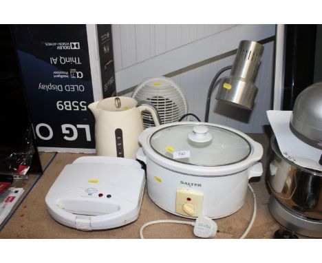 A Salter slow cooker; a Breville sandwich maker; kettle; fan and a desk lamp