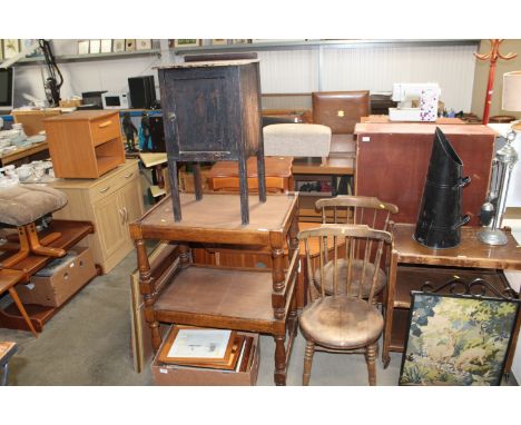 A pair of elm seated stick back kitchen chairs; an oak three tier buffet and a bedside cupboard