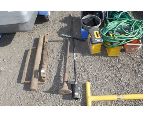 A garden bulb planter and a post rammer