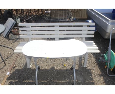 A plastic garden bench and a metal framed table 