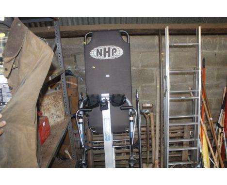 A Pro Fitness rowing machine & an NHP exercise bench