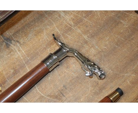 A walking stick with Jaguar style mascot handle