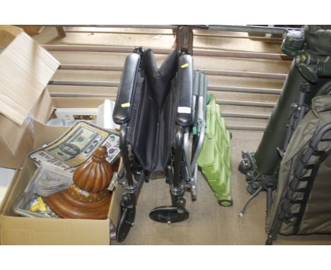 A folding wheelchair, two folding stools and a folding trolley 