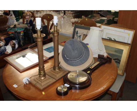 A pair of Corinthian column gilt metal table lamps and shades; an oak banjo shaped barometer; a collection of hats etc.