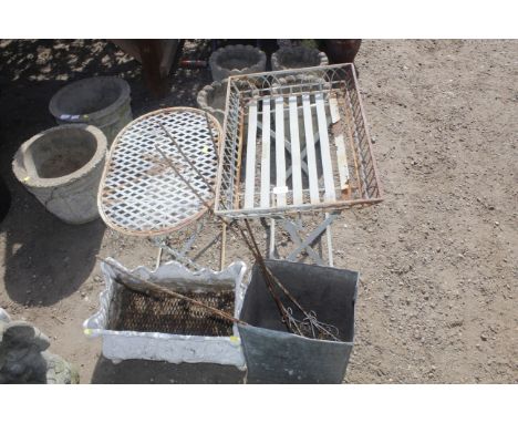 An ornate garden planter, two folding tables and garden stakes etc