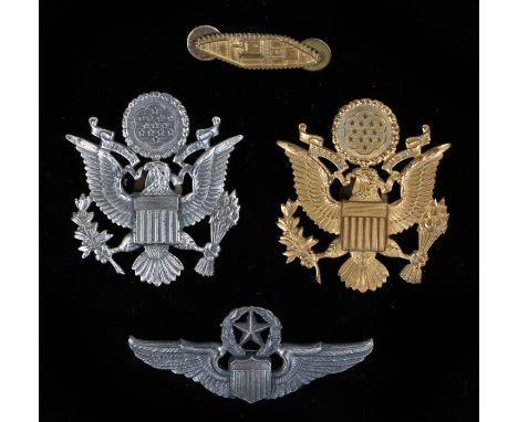 United States Army  officers cap badge and  armoured unit collar insignia, together with a U.S. Air Force cap badge and Comma