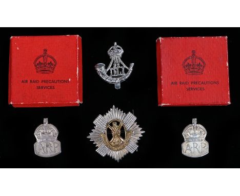 Two George VI silver A.R.P badges, London 1939, maker JC,  with boxes,  together with a chromed cap badge to the Durham Light