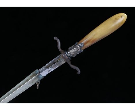 Late 19th Century stiletto with horn grip and twin quillons, diamond shape blade contained in steel scabbard with suspension 