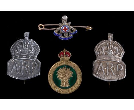 Two World War Two silver ARP badges, both London 1938, maker J.C., together with a Womens Land Army lapel badge, pin fitting,