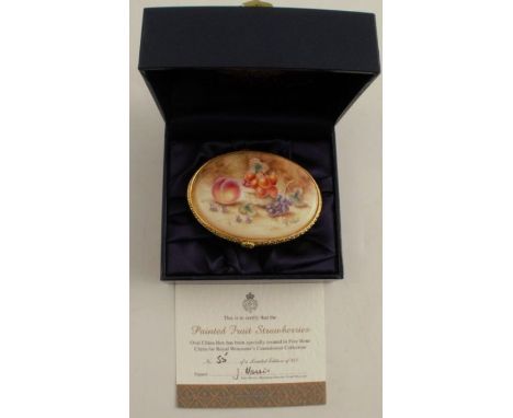 A Royal Worcester enamelled oval patch box, decorated with fruit to a mossy background by S Wood, numbered 55, diameter 2.75i