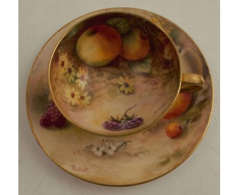 A Royal Worcester miniature cabinet cup and saucer, the interior of the cup and the saucer decorated with fruit to a mossy ba