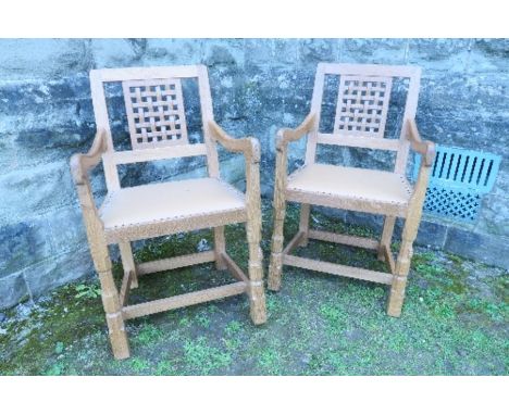 An pair of oak lattice back armchairs, by Robert Mouseman Thompson of Kilburn