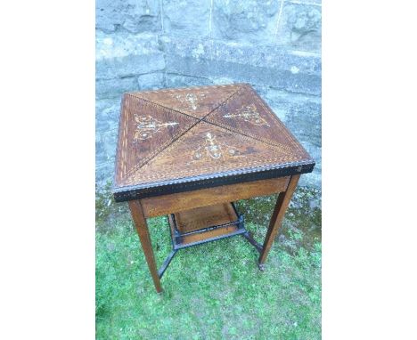 A rosewood bone and boxwood inlaid Victorian envelope card table, raised on four square tapering legs, united by an under she