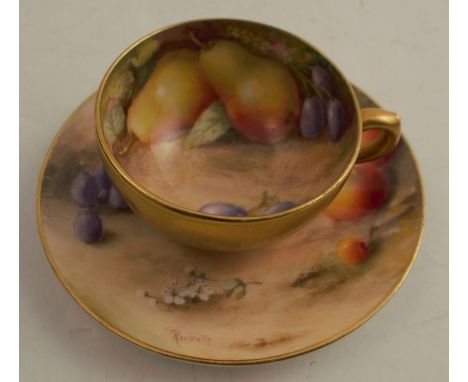 A Royal Worcester miniature cabinet cup and saucer, the interior of the cup and the saucer decorated with fruit to a mossy ba