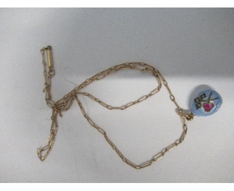 A Russian enamel egg pendant, indistinct marks to the jump ring, decorated with a floral motif set with rubies and rose diamo