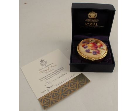 A Royal Worcester enamelled circular patch box, decorated with fruit to a mossy background by S Wood, numbered 83, diameter 2
