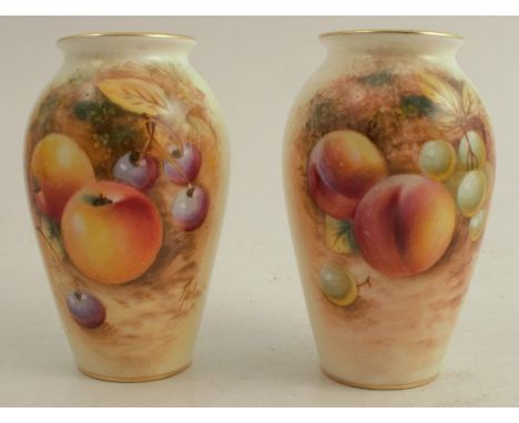 A pair of Royal Worcester vases, decorated half round with hand painted fruit by Roberts, shape number 3461, height approx 4i