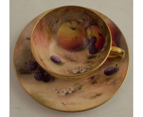 A Royal Worcester miniature cabinet cup and saucer, the interior of the cup and the saucer decorated with fruit to a mossy ba